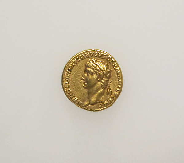 A gold Roman coin bearing a portrait of Claudius.